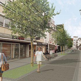 Besucherinnen und Besucher spazieren durch die neue Poststraße.