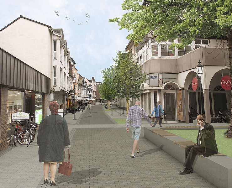 Besucherinnen und Besucher spazieren durch die neue Poststraße.