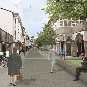 Besucherinnen und Besucher spazieren durch die neue Poststraße.